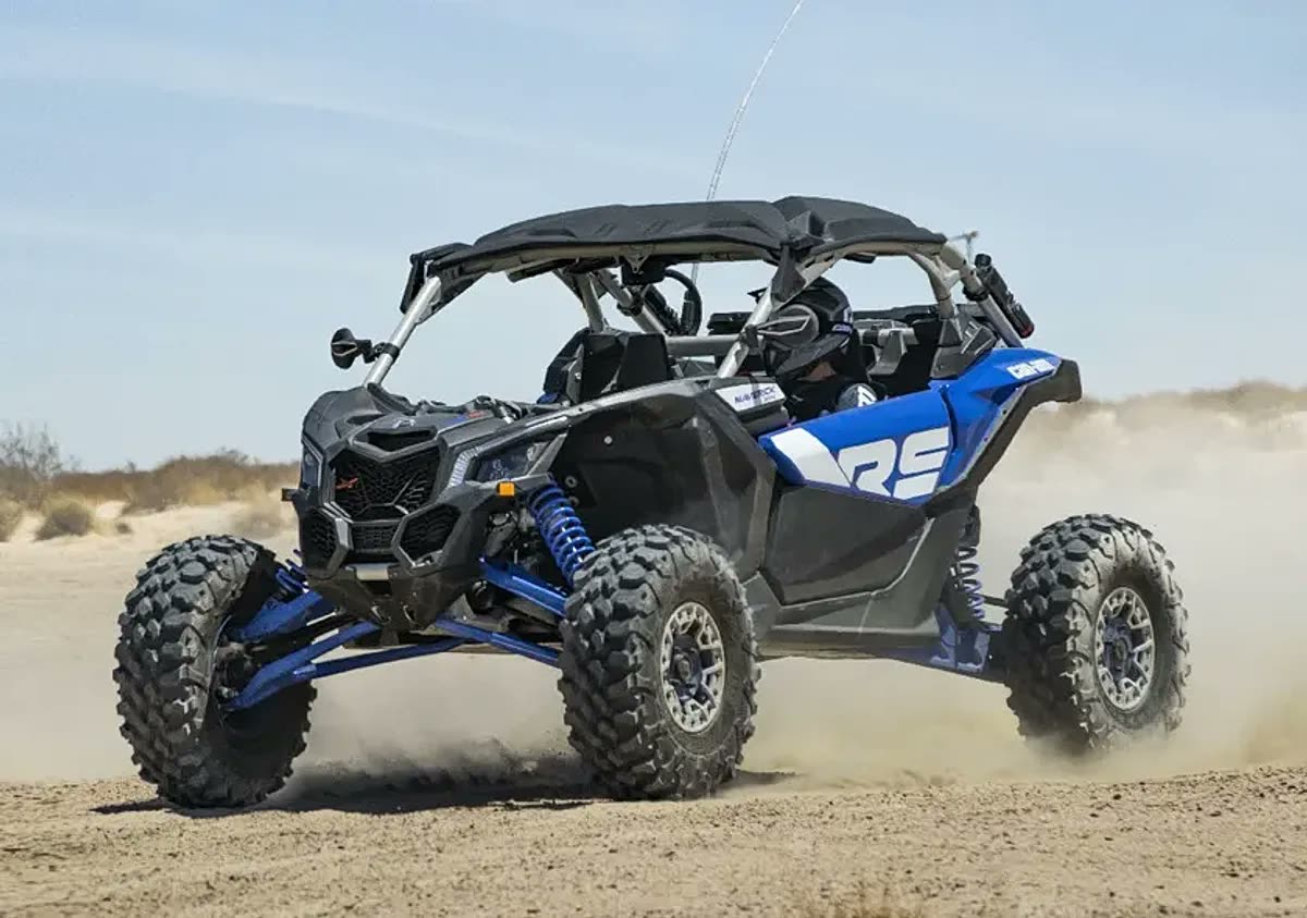 2 Seater Can-Am Maverick X3 Turbo dune buggy on red sand