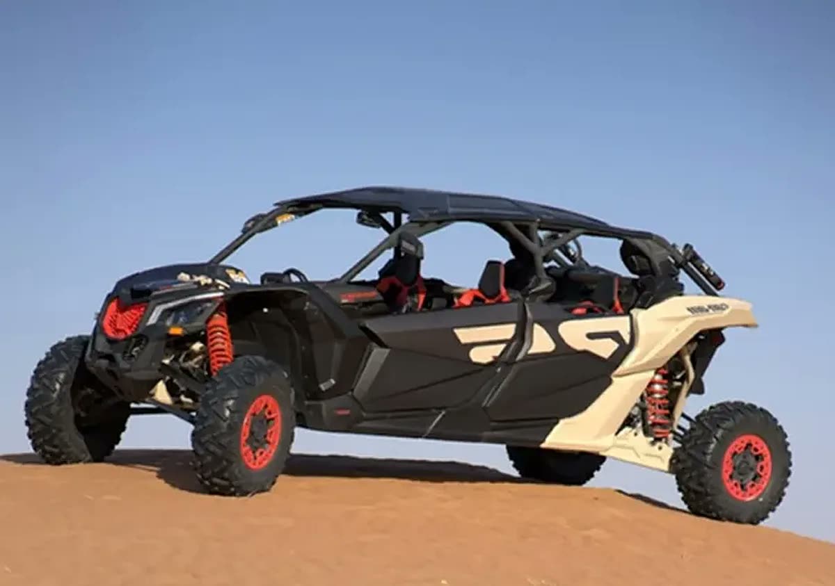 4 Seater Can-Am Maverick dune buggy on red sand