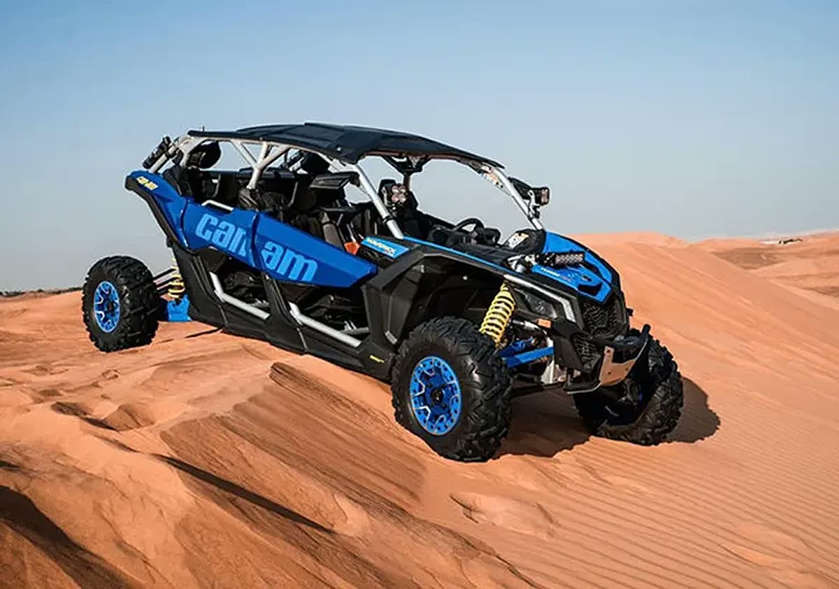 4 Seater Can-Am Maverick X3 Turbo dune buggy on red sand