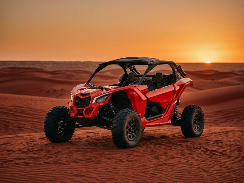 Front three-quarter view of a 2-seater Can-Am Maverick on desert sand