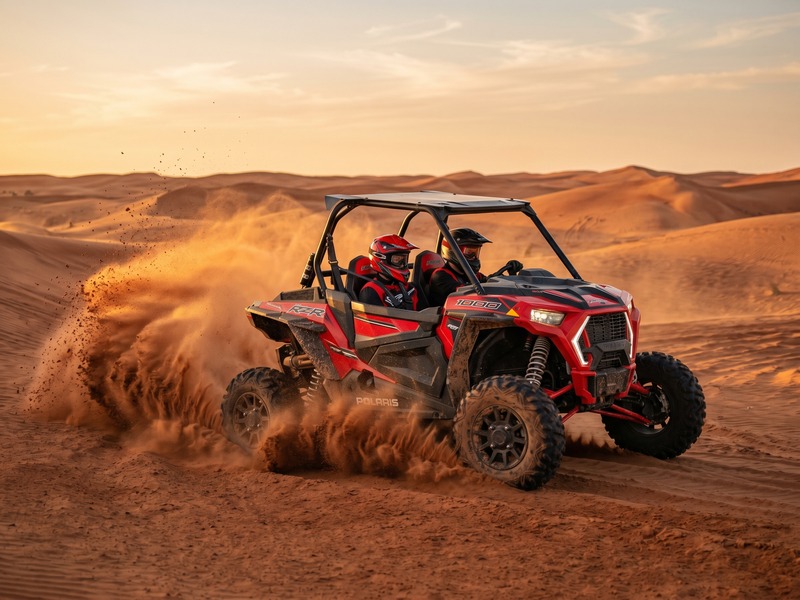 Dune buggy speeding across Dubai red desert