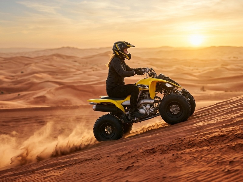 Quad bike riders on Dubai desert dunes