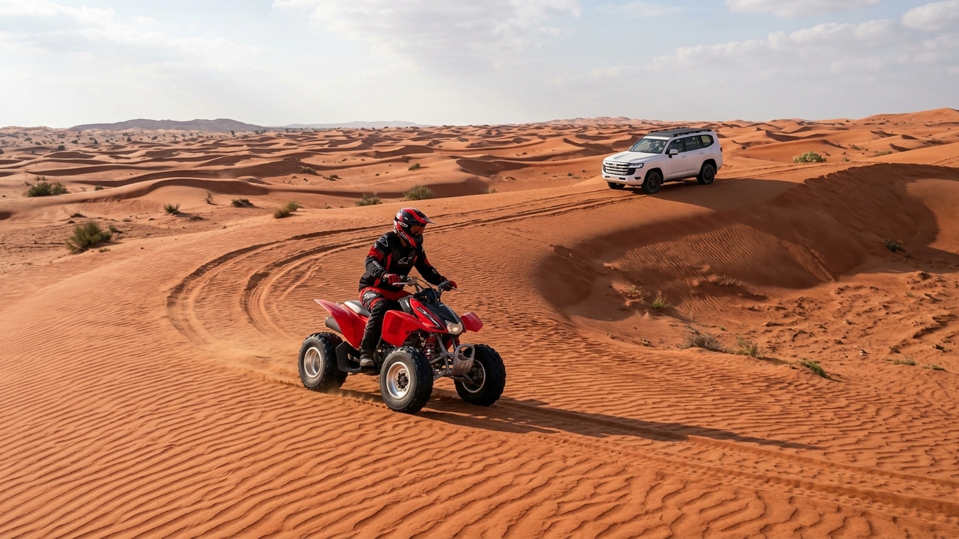 4WD safari SUV beside quad bike at Lahbab Desert Dubai morning convoy