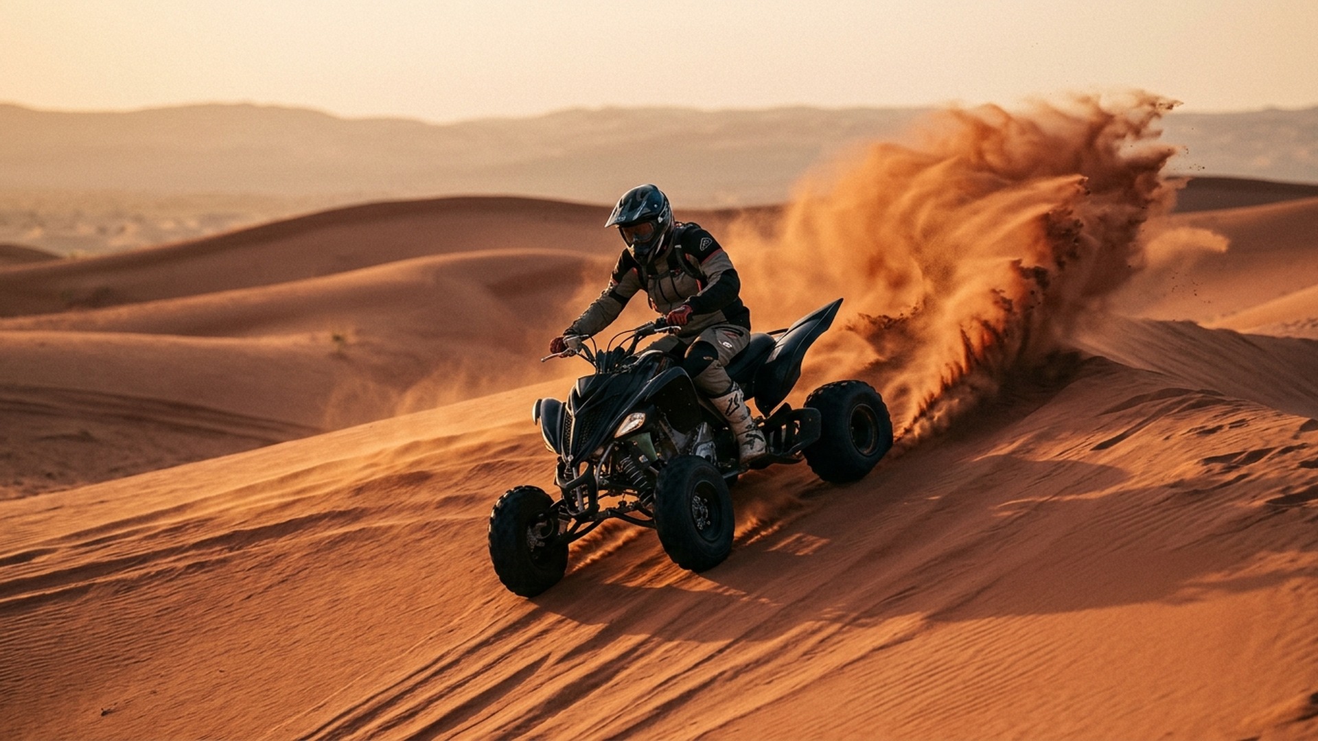 Sports quad skidding on red sand crest